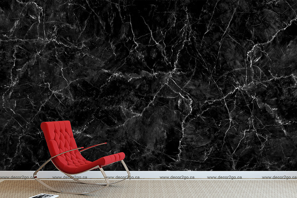 A bold red lounge chair positioned against a Decor2Go Wallpaper Mural with intricate white veining, creating a luxurious visual impact.
