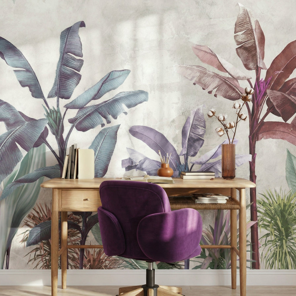 Home office with a wooden desk and purple chair against a wall with tropical plant wallpaper.