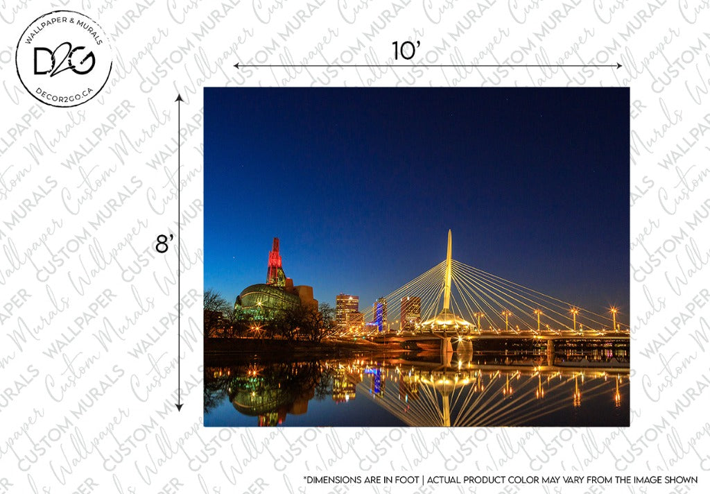 Nighttime cityscape featuring a modern cable-stayed bridge with illuminated cables and nearby buildings in colorful lights, reflected on a calm river. Decor2Go Wallpaper Mural watermark and measurement indicators overlay. This scene features the Winnipeg Bridge Wallpaper Mural.