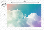 A large wall mural measures 13 feet by 9 feet and features a pastel-colored sky with fluffy white clouds. The top section has a teal gradient transitioning to a soft lavender hue at the bottom, creating an enchanting beauty. This Rainbow Sky Wallpaper Mural by Decor2Go Wallpaper Mural adds a serene and dreamy ambiance to the space.