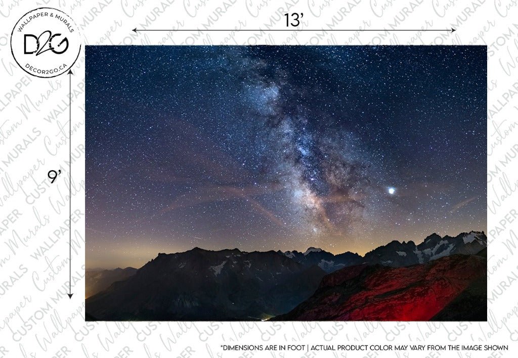 A vivid night sky filled with stars and the Decor2Go Milky Way Wallpaper Mural above a mountain range, with faint illumination on the peaks; a watermark and border information present.