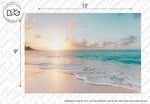 A serene beach view paradise at sunset, with gentle waves lapping along the sandy shore. The sky is a blend of soft pastel colors, including pink, orange, and blue. The horizon is dotted with a few clouds as the sun nears the horizon. Perfect for a Tahiti Wallpaper Mural by Decor2Go Wallpaper Mural. (Dimensions: 13' x 9').