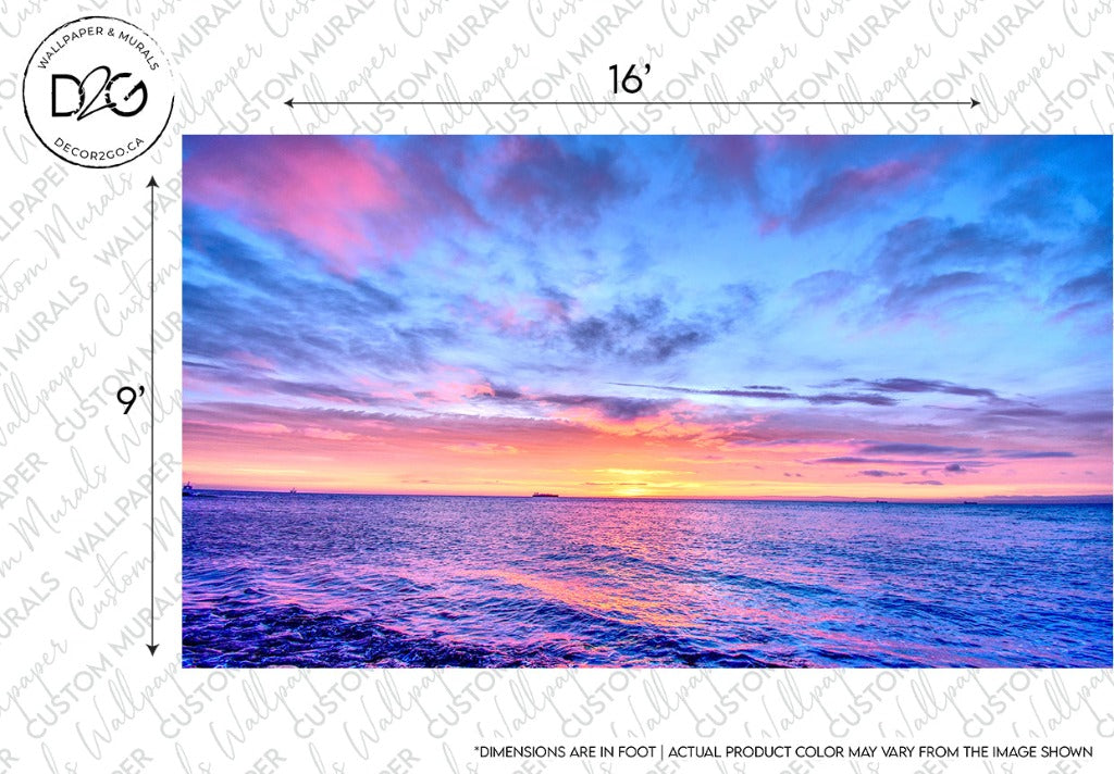 Vivid sunset over the ocean with a vibrant mix of pink, blue, and purple hues in the sky, reflecting on the gentle waves of the sea. This Decor2Go Wallpaper Mural includes dimensions marked on the edges.