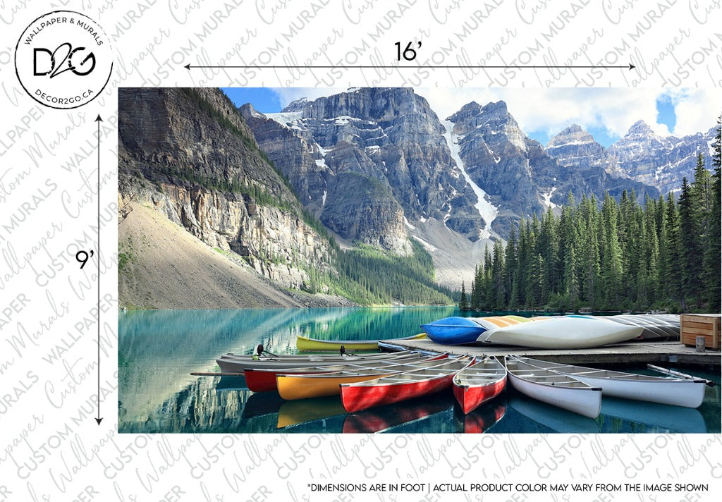 A picturesque Decor2Go Wallpaper Mural with colorful kayaks lined up on the shore of a tranquil, reflective turquoise lake, surrounded by towering, rugged mountains and lush green forests.