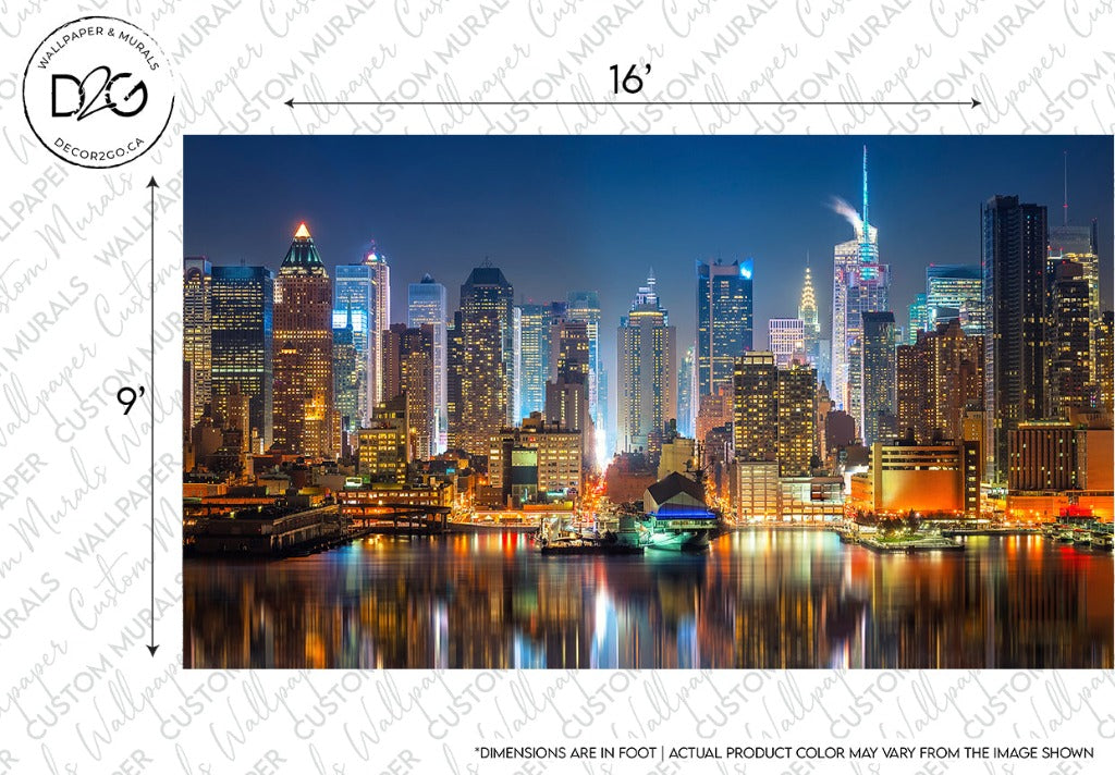 A panoramic night view of the NYC skyline with illuminated skyscrapers, highlighting the Empire State Building, viewed across a river with a watermark and custom sizing indicators can be beautifully displayed with the Decor2Go Wallpaper Mural.