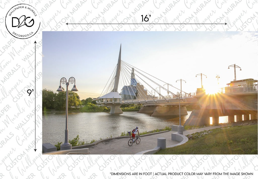 A person cycling on a path near a river at sunset, with a Decor2Go Wallpaper Mural Urban Bridge Wallpaper Mural in the background and street lamps along the path. Watermark "doppler records" in the
