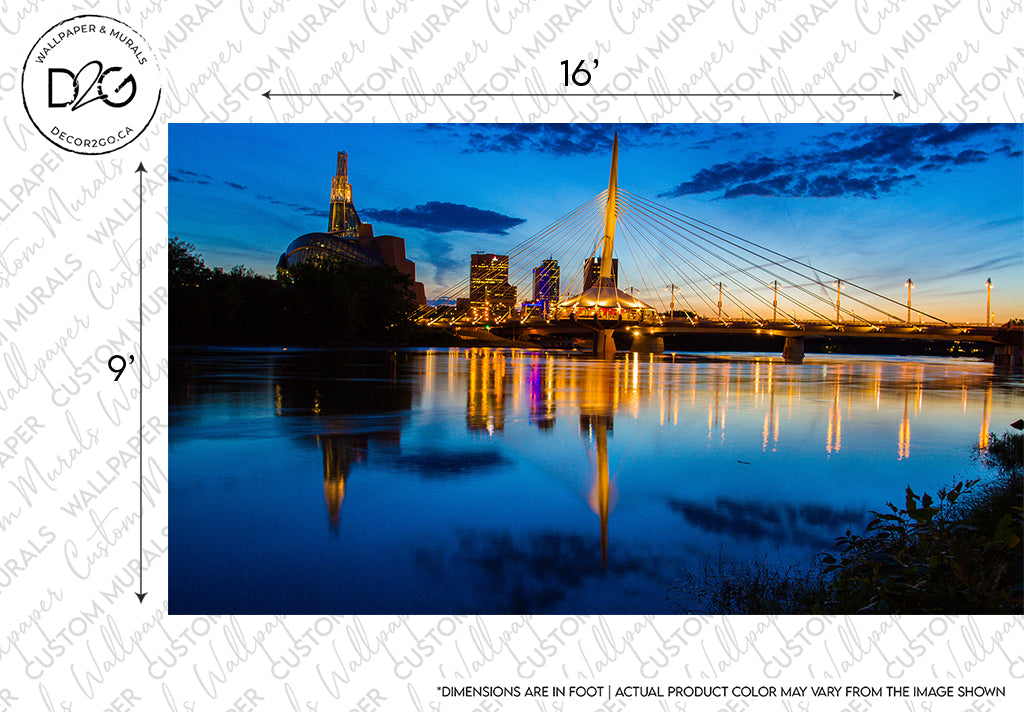 A scenic view of a Winnipeg Twilight Wallpaper Mural by Decor2Go Wallpaper Mural at dusk with a prominent bridge reflected over the calm waters of a river. Buildings are illuminated, and the sky has hues of blue and orange.