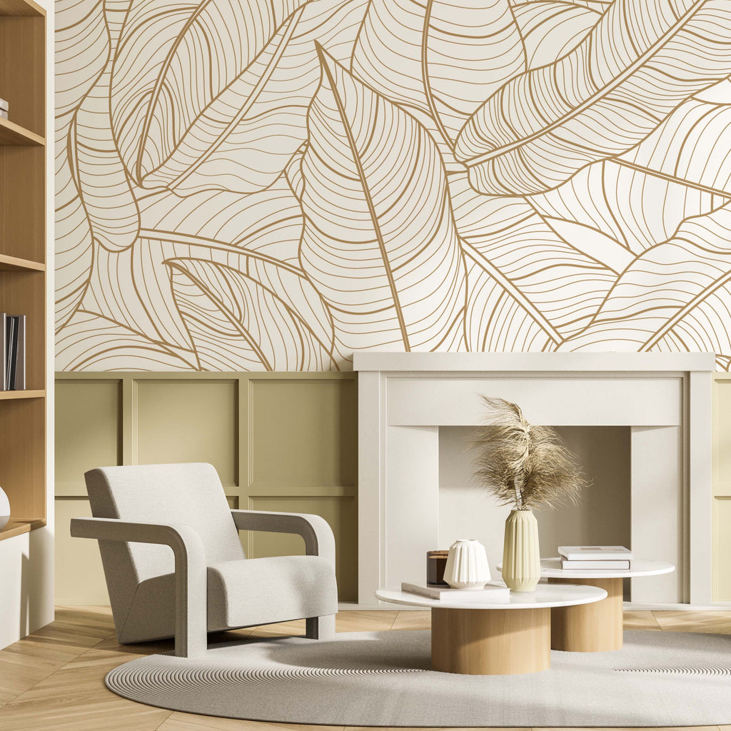 Contemporary living room with beige armchair, wooden furniture, and a Decor2Go Wallpaper Mural featuring golden leaves. Includes a round center table with vases and decorations.
