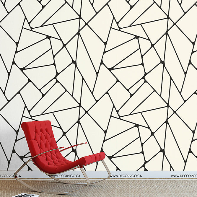 Red chair with black and white wallpaper