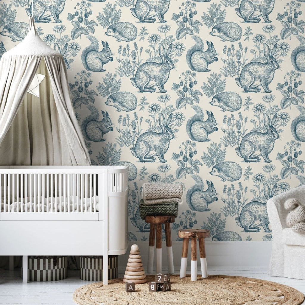 Nursery - Blue hand drawing animals and plants in a boho nursery room