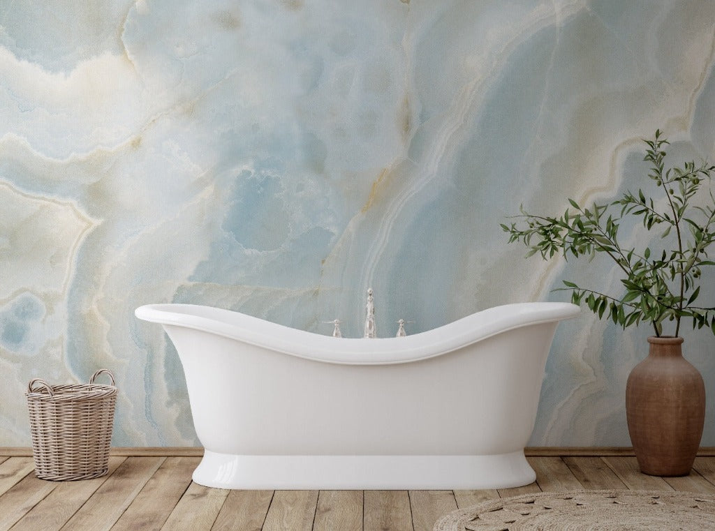 Bathtub with subtle decoration and blue marble wallpaper 