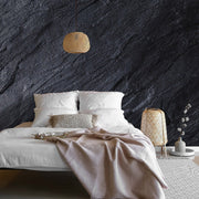 Bedroom - A modern bedroom with a low bed dressed in white linens against a Decor2Go Wallpaper Mural. Includes hanging rattan lamps, a small side table, and a beige throw blanket.