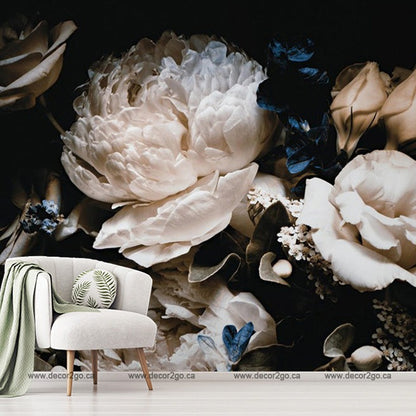 A stylish interior setting featuring Decor2Go Wallpaper Mural's Bouquet of White Peonies as a backdrop, with a modern chair and small table adorned with plants in the foreground.