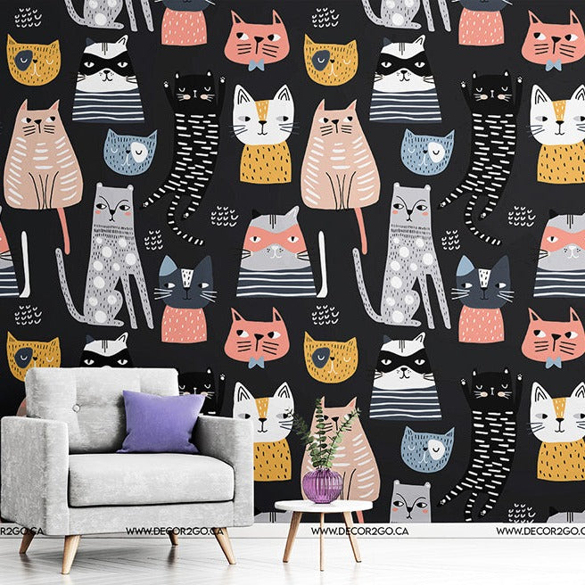 A stylish room with a gray couch and a small plant against Decor2Go Wallpaper Mural featuring Cartoon Cats Wallpaper Mural.