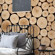 Bedroom - A cozy bedroom featuring a black metal daybed with pillows and throws against a Decor2Go Wallpaper Mural, next to a small black side table and chalkboard.