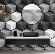Bathroom - A modern bathroom featuring a black basin on a white countertop, a large round mirror, and Decor2Go Wallpaper Mural's Cubic Grays wallpaper on the walls. Hanging pendant lights add a warm glow.