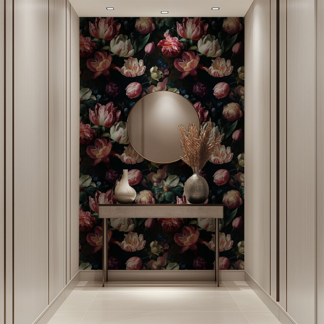 A hallway featuring Decor2Go Wallpaper Mural's Dark Elegance Floral Wallpaper Mural showcases a round mirror above a narrow table. The table displays two vases, one containing dried grasses. Vertical paneling lines the walls, complemented by light-colored tiled flooring.