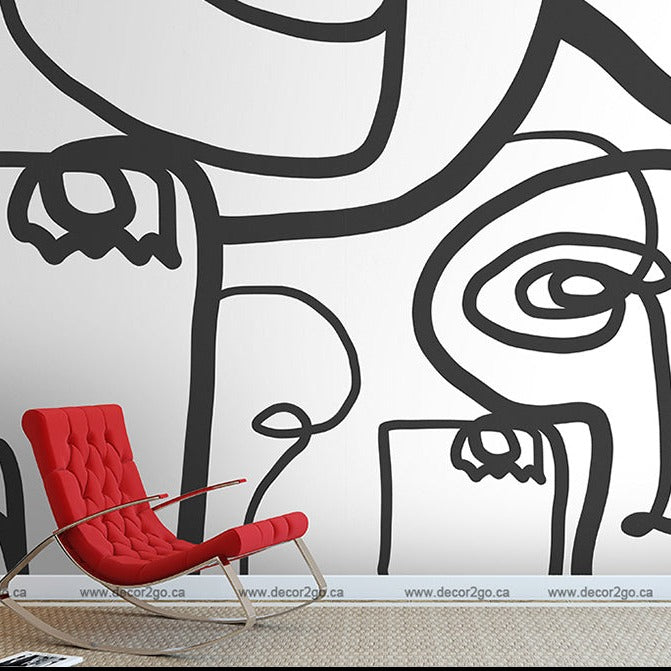 A modern room with a large, Decor2Go Wallpaper Mural on the wall and a bright red contemporary chair in the foreground.