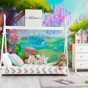 Bedroom - A colorful children's bedroom featuring a bed with a whimsical forest-themed backdrop, a teddy bear on striped bedding, a Decor2Go Fantasy Kingdom Wallpaper Mural, and a white dresser.