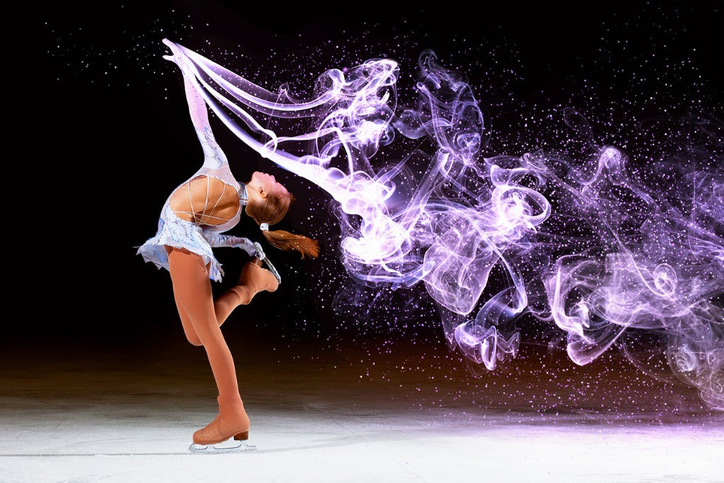 A Decor2Go Wallpaper Mural portrays a figure skater performing a graceful pose on ice, embodying feminine elegance with a dynamic trail of shimmering purple light and smoke effects swirling around her. The background is dark, highlighting the vivid light.