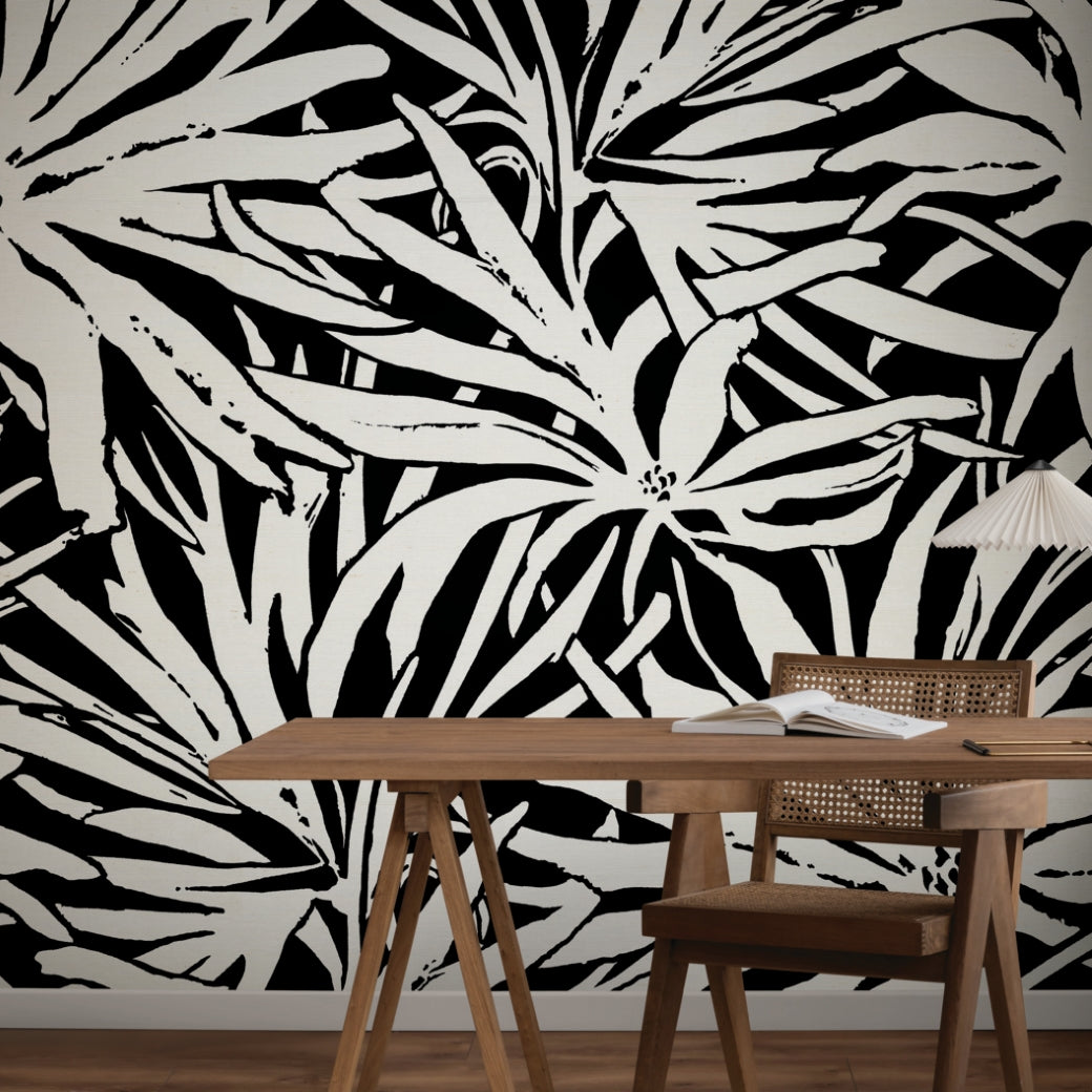 A desk and chair sit in front of a wall adorned with York Wallcoverings’ Floral Canopy Black Wallpaper Mural (Panels).