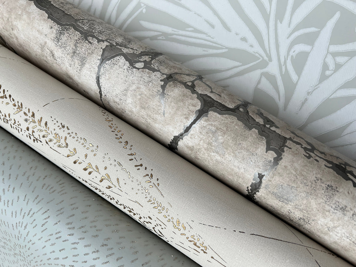 Three rolls of York Wallcoverings' Floral Canopy Grey Wallpaper (60 SqFt) are shown: the top with a gray stone pattern, the middle with a gold and beige botanical motif, and the bottom with a light gray dotted design.