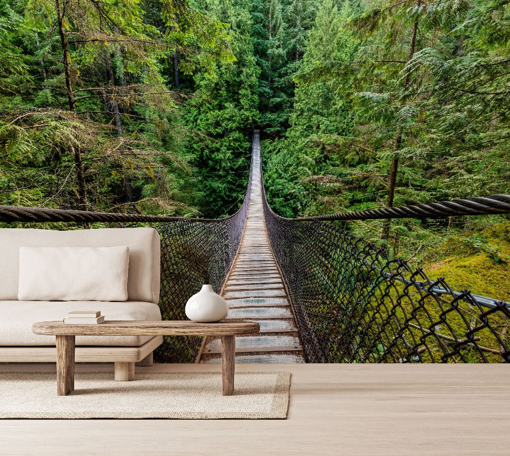 Living Room - A surreal custom wall mural where a cozy living room setup with a sofa and coffee table seamlessly transitions into the Decor2Go Wallpaper Mural Forest Suspension Bridge Wallpaper Mural.