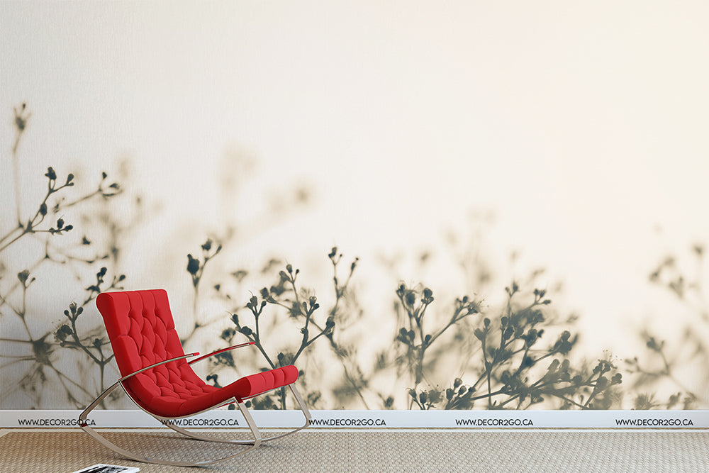 A modern red lounge chair positioned against a neutral wall decorated with a subtle, Fragile Flowers Wallpaper Mural from Decor2Go Wallpaper Mural, creating a serene and stylish atmosphere.