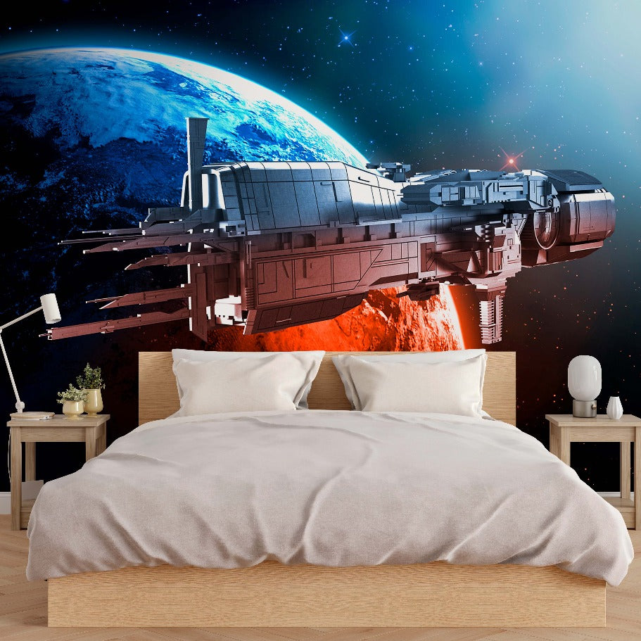 A modern bedroom with a large bed and simple furniture, featuring a Decor2Go Wallpaper Mural of a spaceship flying near a vibrant orange planet with a distant view of earth.