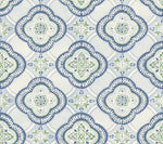 A decorative pattern featuring symmetrical, ornate designs in shades of blue, green, and white. The motifs are shaped like stylized four-petaled flowers enclosed in diamond-like frames, reminiscent of botanical elegance and creating a repeating geometric arrangement on a light background. Presenting the Garden Trellis Hazel Wallpaper Beige, Brown (60 Sq.Ft.) by York Wallcoverings.