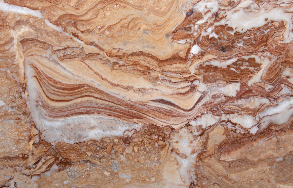 Close-up of a Gemstone Diffused Marble Wallpaper Mural by Decor2Go Wallpaper Mural with swirling shades of brown, tan, and white, showing intricate, layered textures and formations in the stone.