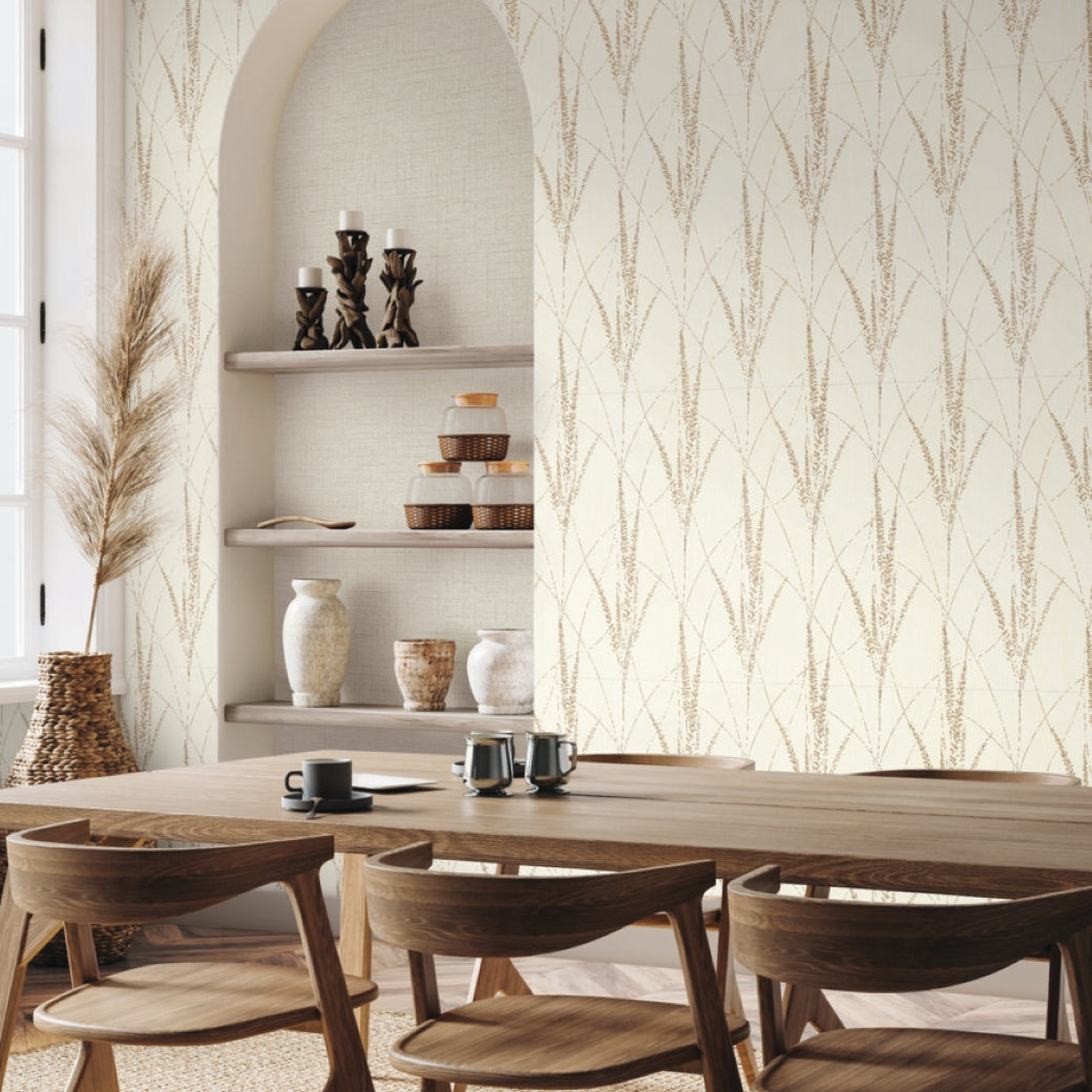 Dining Room - A modern area with a wooden table, chairs, built-in shelves holding ceramic vases and candles, and a vase of dried pampas grass by a bright window is accented by York Wallcoverings’ Graceful Willow Cotton Wallpaper (60 SqFt)