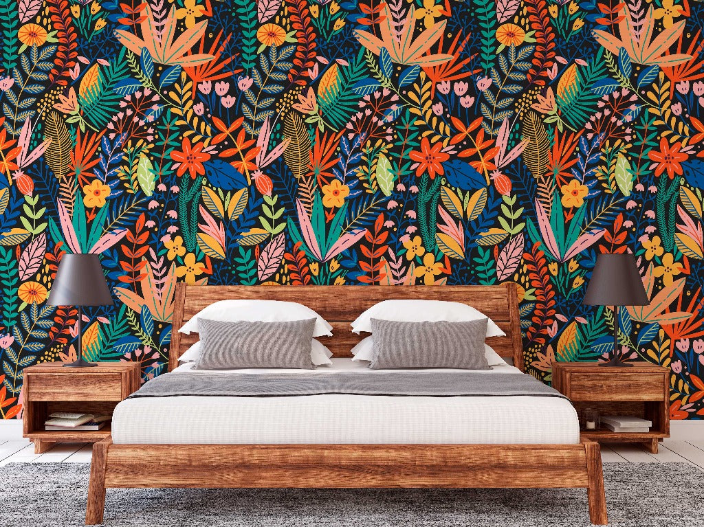 A modern bedroom featuring a wooden bed with white bedding, flanked by wooden nightstands and black lamps, set against a vibrant, multicolored Heart of the Jungle Wallpaper Mural by Decor2Go Wallpaper Mural.