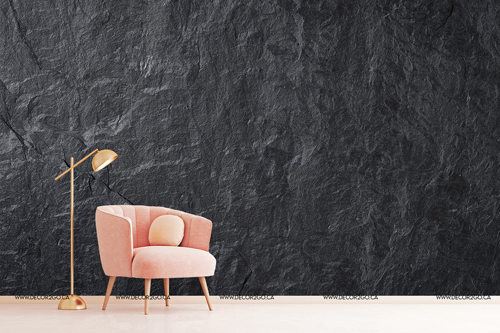 A pink armchair and a gold floor lamp stand against a textured Decor2Go Wallpaper Mural wall in a minimalist setting.
