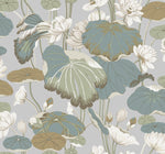 A detailed Lotus Pond Heather/Cotton Wallpaper Grey, Blue (60 Sq.Ft.) pattern by York Wallcoverings features large green, brown, and blue leaves of water lilies interspersed with white and cream-colored lotus flowers on a light gray background. The design is ornate yet tranquil, giving a natural and serene feel while offering easy installation.