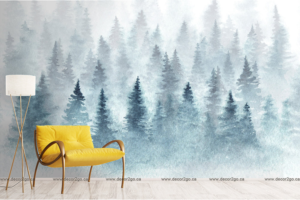 A stylish room with a mustard yellow accent chair and a floor lamp, against a wall with Decor2Go Wallpaper Mural depicting Misty Tree Tops in shades of blue and green.