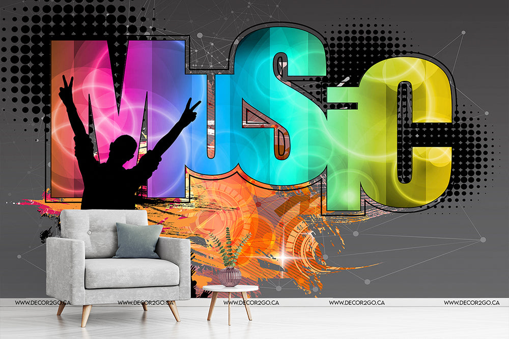 A vibrant graphic depicting a silhouetted figure with arms raised against a colorful abstract background titled "Music Mania Wallpaper Mural" in bold, artistic letters, accompanied by a modern gray armchair.