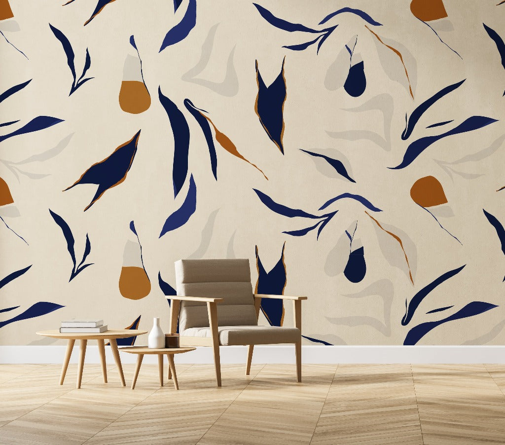 Living Room - A modern living room corner with a stylish armchair and a small round table against a feature wall featuring a large, Decor2Go Wallpaper Mural in blue, beige, and orange tones.