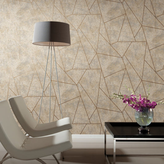 A modern living room with two white chairs, a metallic floor lamp, and a black coffee table holding a vase of purple flowers. The wall features the Neutral & Gold Nazca Wallpaper by York Wallcoverings, enhancing the contemporary design with its beige geometric pattern.