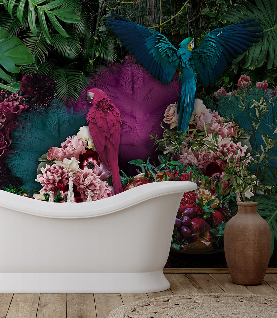 A vibrant image featuring a white bathtub surrounded by lush, tropical Parrot Paradise Wallpaper Mural flora and a vivid display of flowers, with a majestic parrot perched on the edge and another in flight above. Designed by Decor2Go Wallpaper Mural.