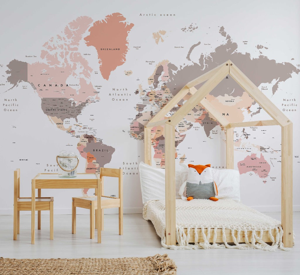 Bedroom - A child's bedroom with a wooden house-frame bed, Peach World Map Wallpaper Mural from Decor2Go Wallpaper Mural, a small table and chair set. The decor includes a stylish rug and soft pillows.
