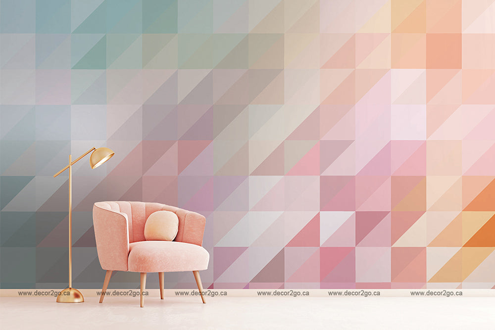 A minimalist living room with an elegant pink armchair and a stylish golden floor lamp, against a Decor2Go Wallpaper Mural pink and blue geometry wallpaper mural.