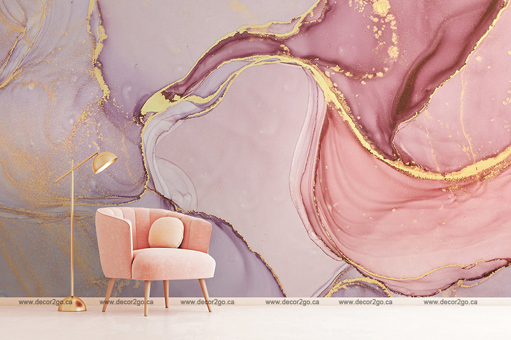 A stylish room featuring a pink armchair and a gold floor lamp against a wall with Decor2Go Wallpaper Mural in shades of purple, pink, and gold.