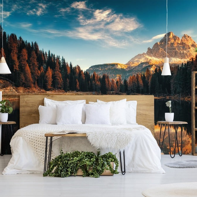 A cozy bedroom featuring a neat bed with white linen and fluffy pillows, flanked by bedside tables and pendant lights, set against a Decor2Go Wallpaper Mural.