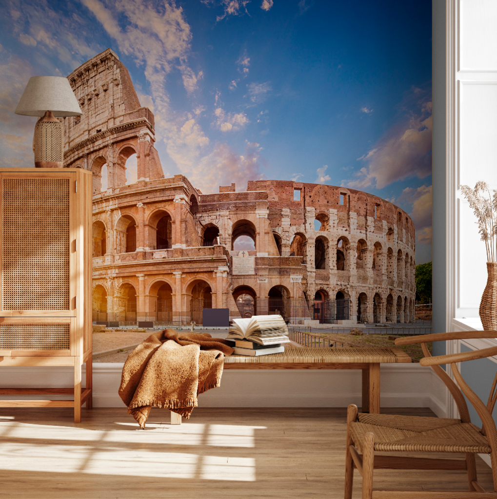 A modern living room seamlessly blending with a Decor2Go Roman Colosseum Wallpaper Mural under a bright blue sky, featuring wooden furniture and cozy decor.