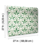 A roll of York Wallcoverings Sevilla Clover Wallpaper Green (60 Sq.Ft.) featuring a green, nature-inspired pattern with symmetrically arranged leaf-like shapes on a white background. The SureStripª material enhances the geometric elegance of the design. Dimensions: 27 feet (8.23 meters) long and 27 inches (68.58 centimeters) wide.