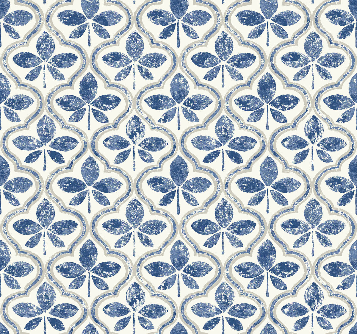 A repeating vintage-inspired pattern featuring blue, clover-like shapes set in a symmetrical design against a light beige background. This Sevilla River Rock Wallpaper Grey (60 Sq.Ft.), made by York Wallcoverings, showcases distressed blue shapes that impart an aged, antique look of geometric elegance.