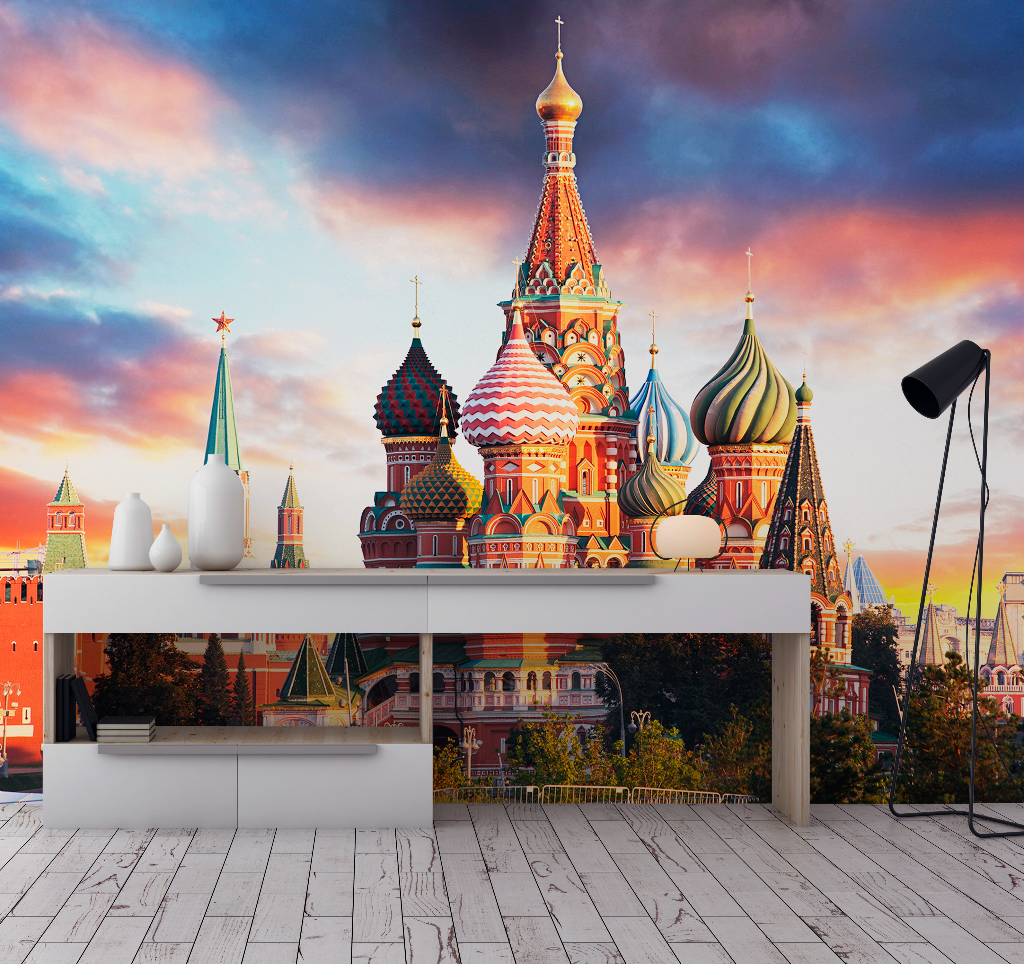 A miniature model of Decor2Go Wallpaper Mural, displayed on a white table against a vibrant sunset backdrop with clouds, blending into a realistic scene.