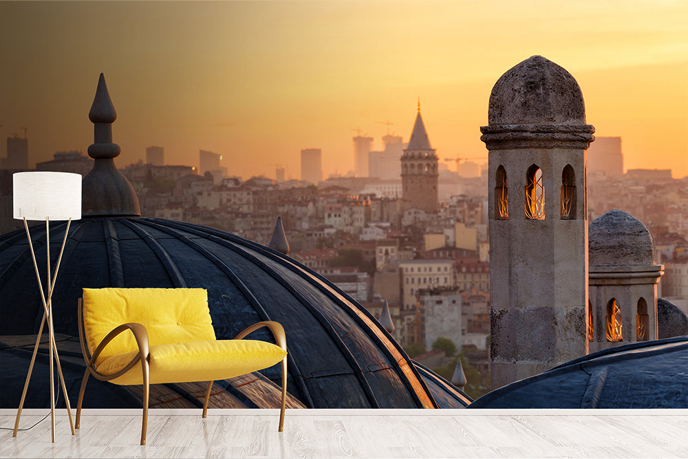 Living Room - A modern living room features a yellow chair and a white floor lamp on a light wooden floor, set against a Decor2Go Wallpaper Mural. The mural showcases domed rooftops and towers, creating a serene and warm ambiance with its high-quality materials.