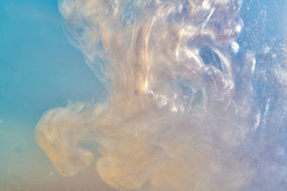 Close-up image of a unique shimmer, swirling substance with intricate textures, set against a soft blue background, resembling a cloud of smoke Decor2Go Wallpaper Mural.